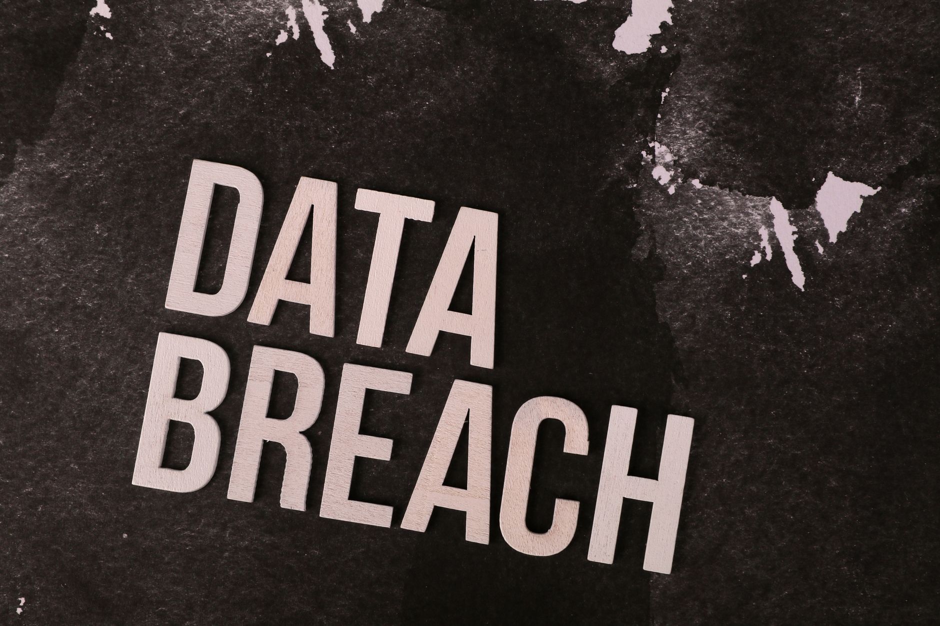Dark screen with code representing a cybersecurity exploit or network breach