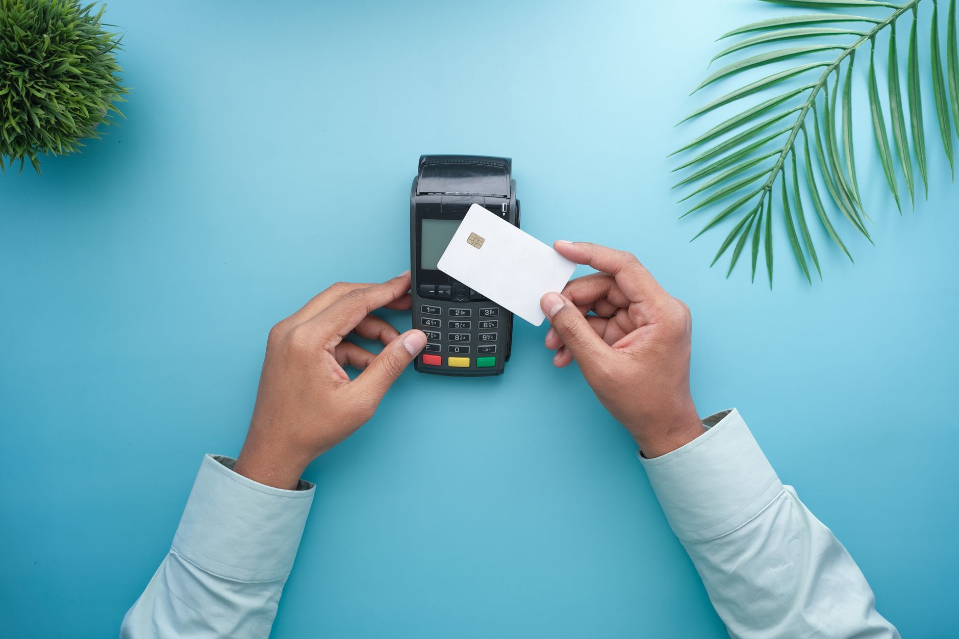Person making a contactless card payment representing Visa network integration for stablecoin spending