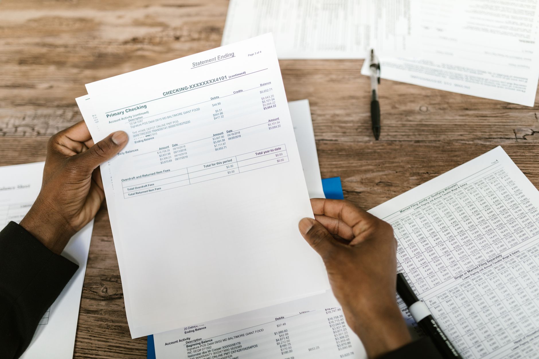 Legal and financial regulatory documents on a desk