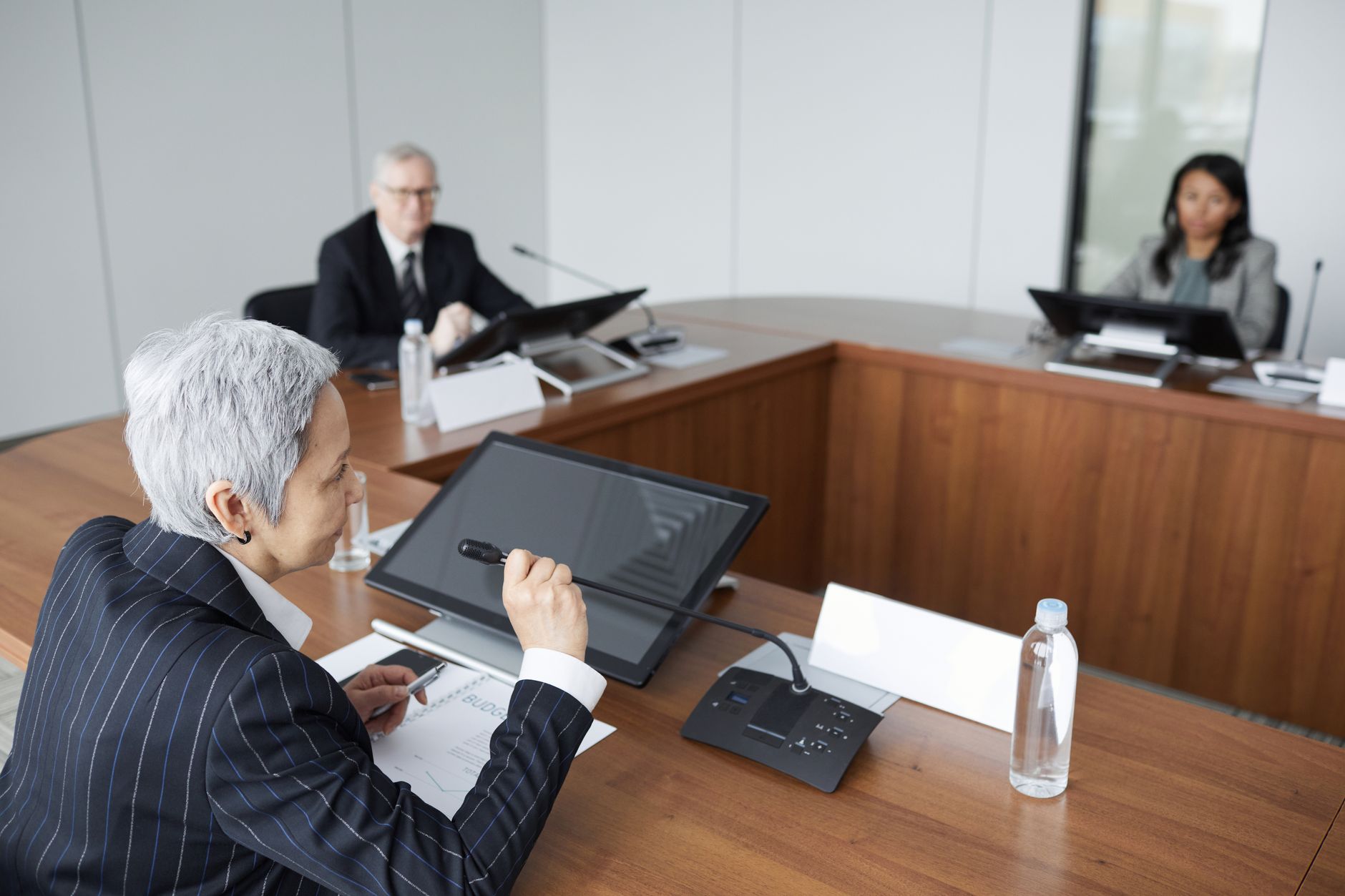 Business team reviewing technology adoption data in a meeting room