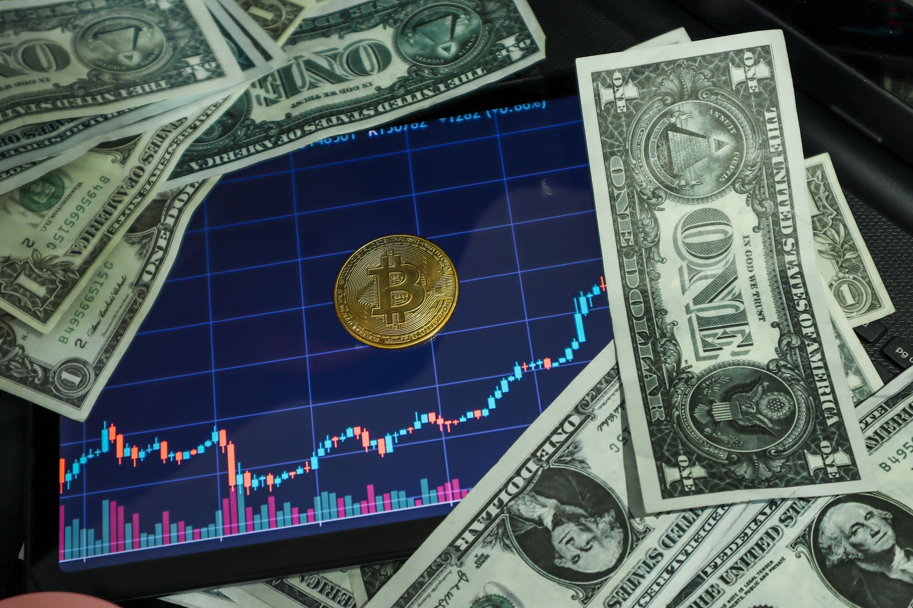 Financial professional reviewing digital asset data on multiple screens